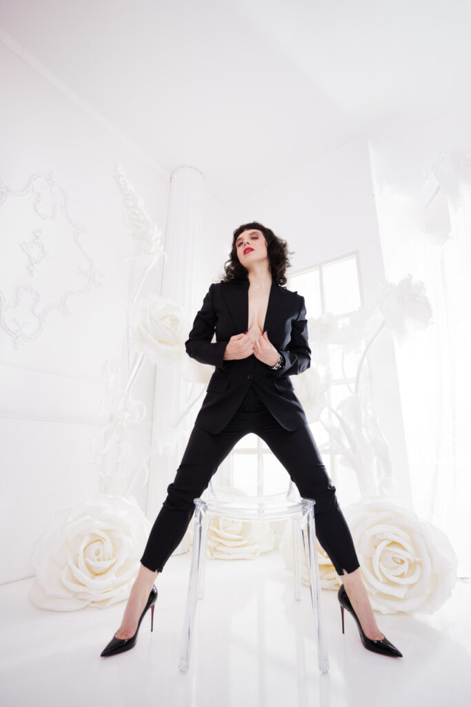 Berlin Dominatrix Lady Vyra in a black suit and black high heels