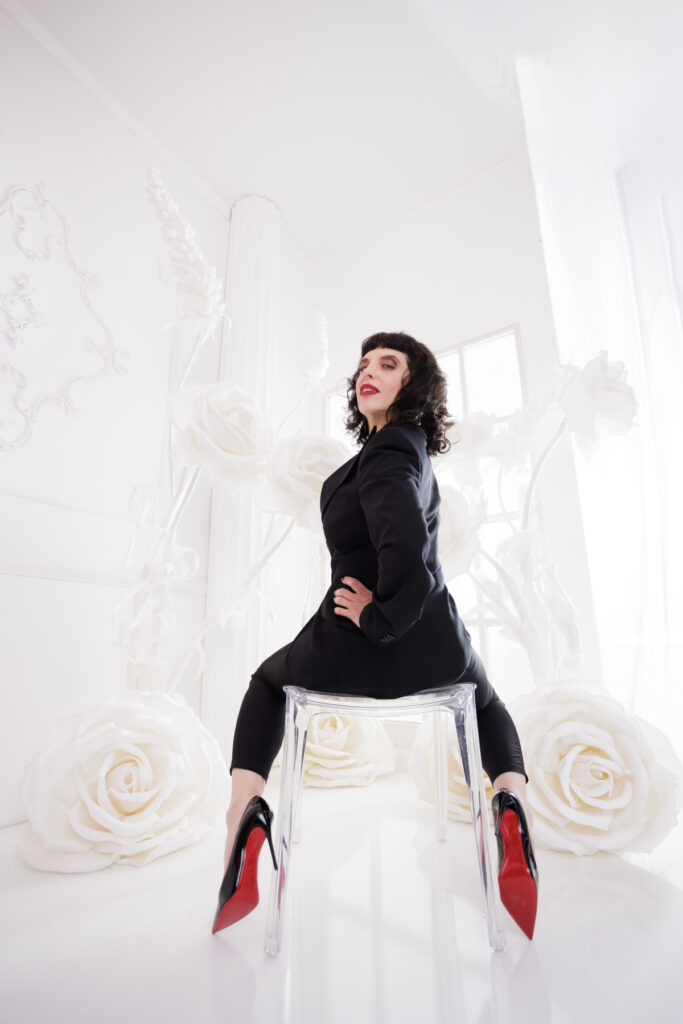 Berlin Dominatrix Lady Vyra in a black suit and black high heels